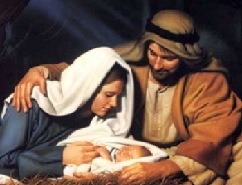Jésus couché dans une cèche avec Marie et Joseph