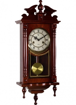 Une vieille pendule et son balancier